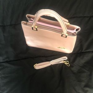 Aimily baby pink color Handbag with removable straps.